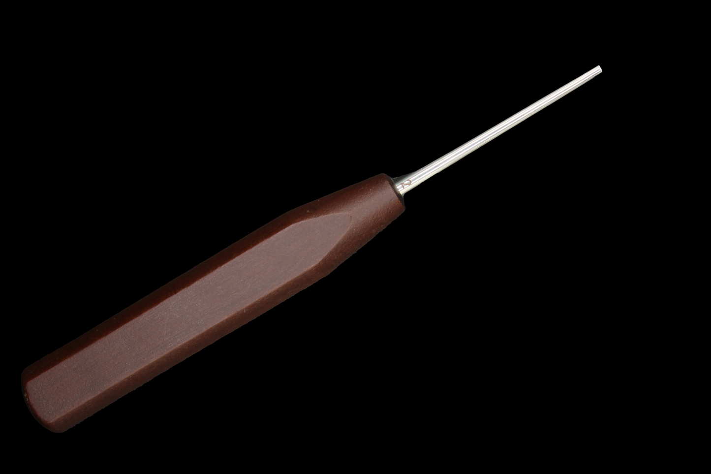 Wooden-handled oboe mandrel on a black background